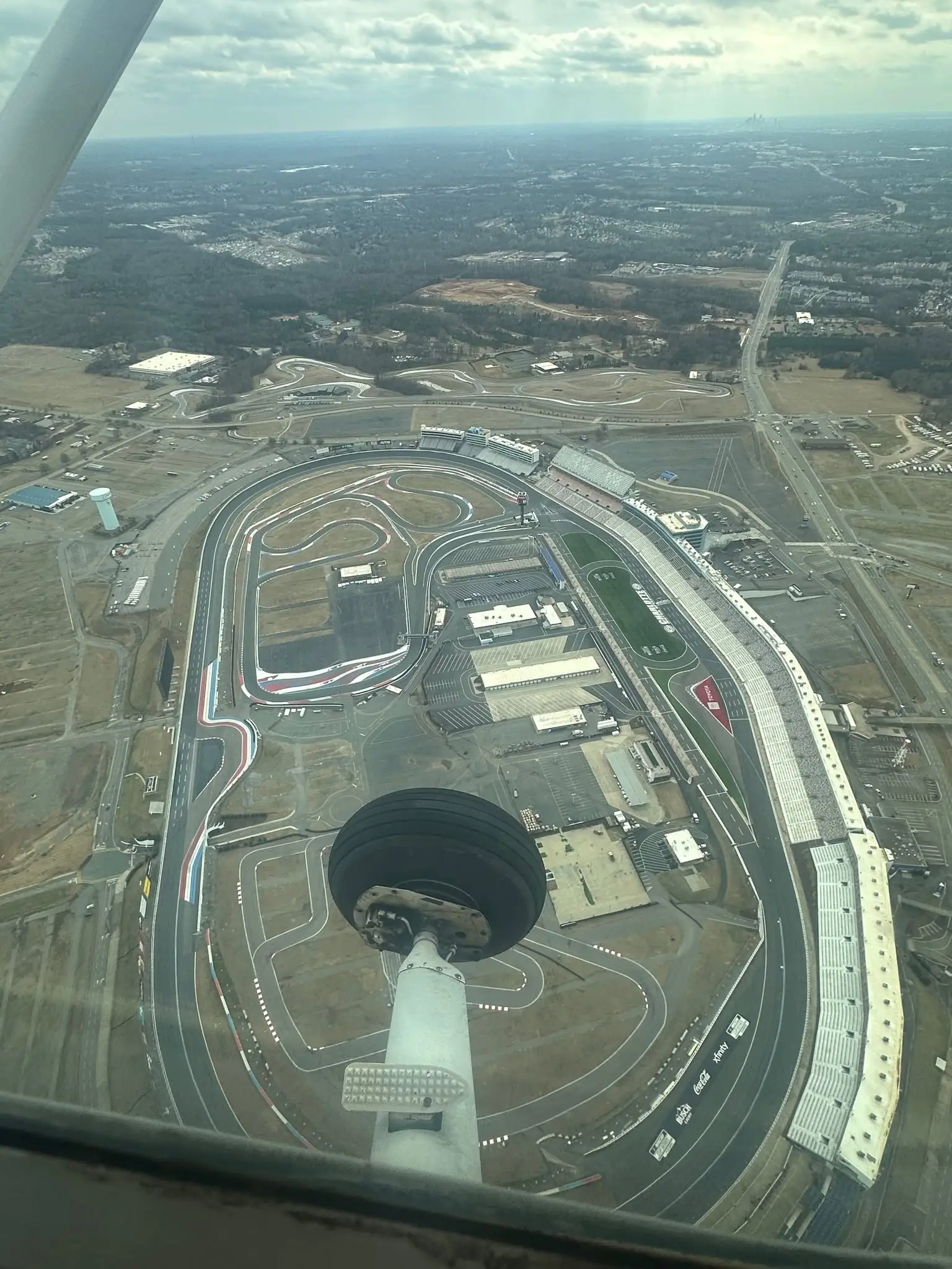 View of the airport runway from a plane window at Triad Aviation Academy