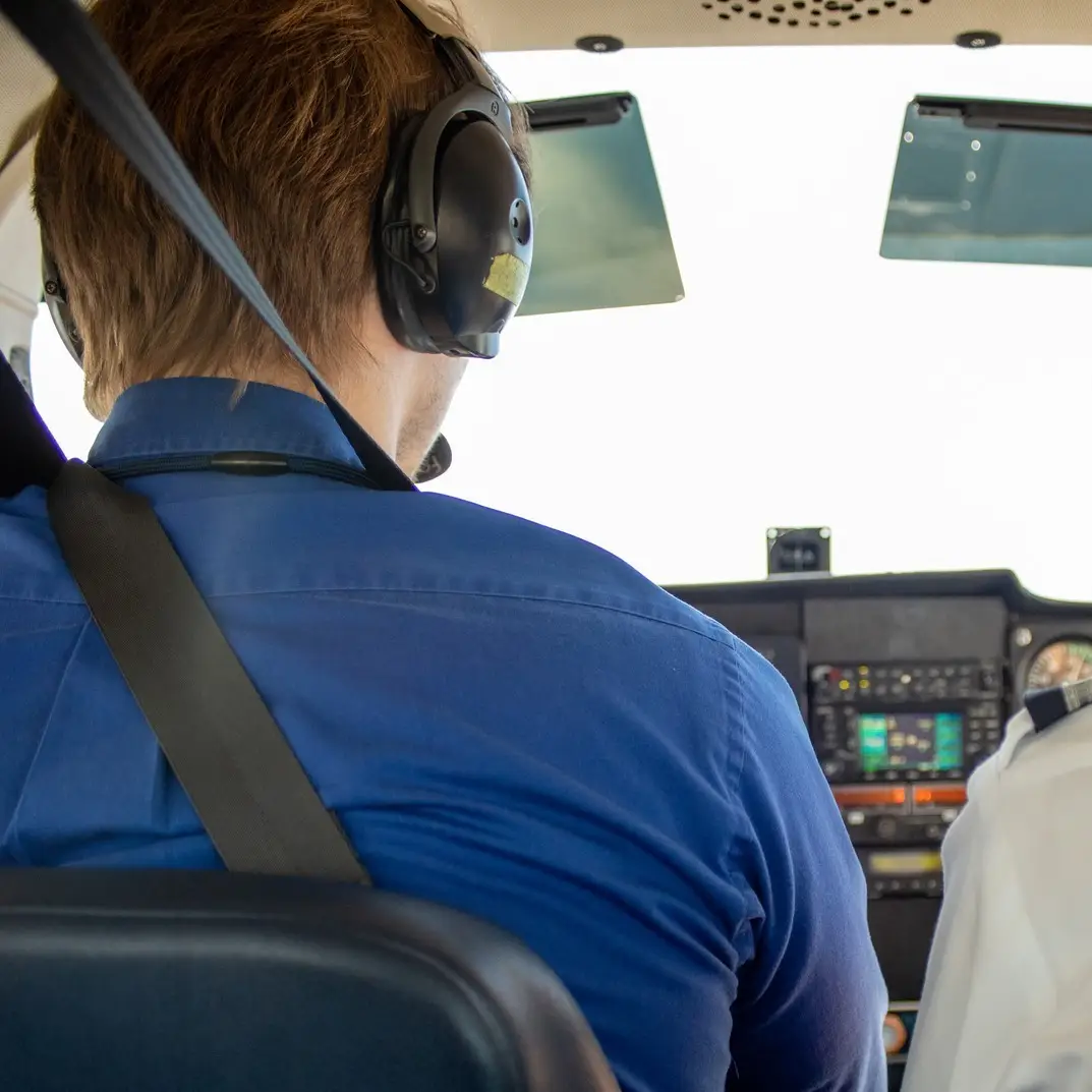 Pilot in the cockpit of a regional airline aircraft