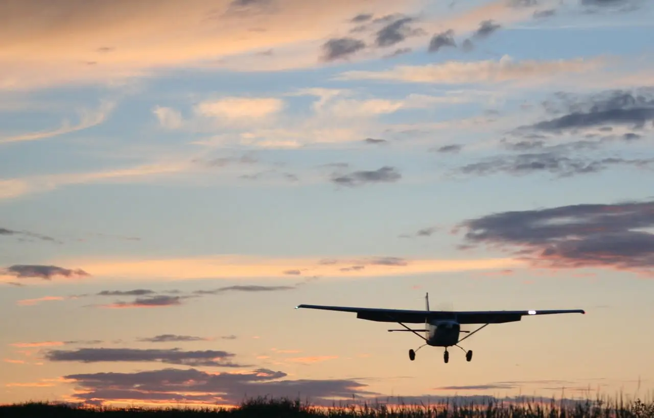 Cessna airplane landing gracefully at dawn