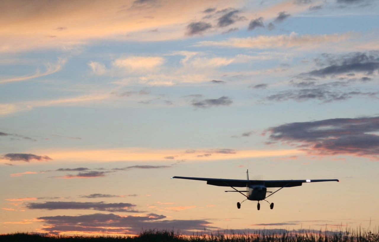 Cessna aircraft landing at dawn, representing the flight training journey