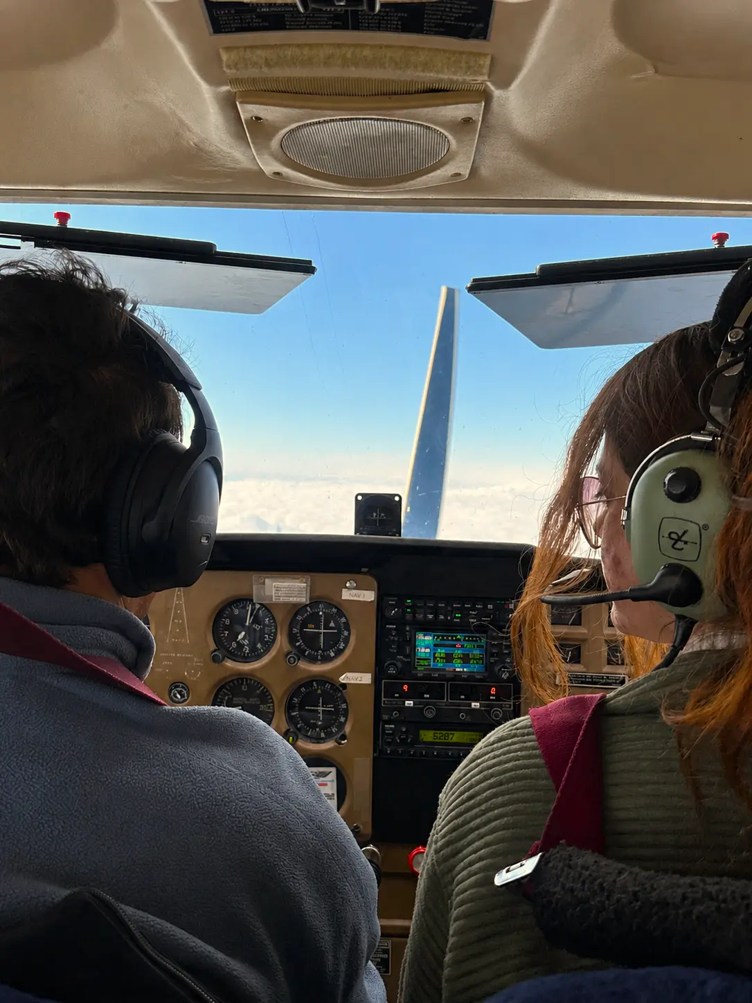 Student and CFI inside cockpit during a training flight