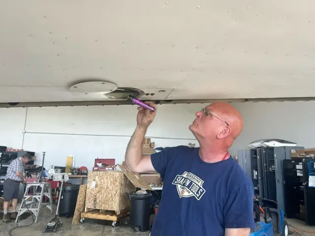 Mechanic fixing airplane wing