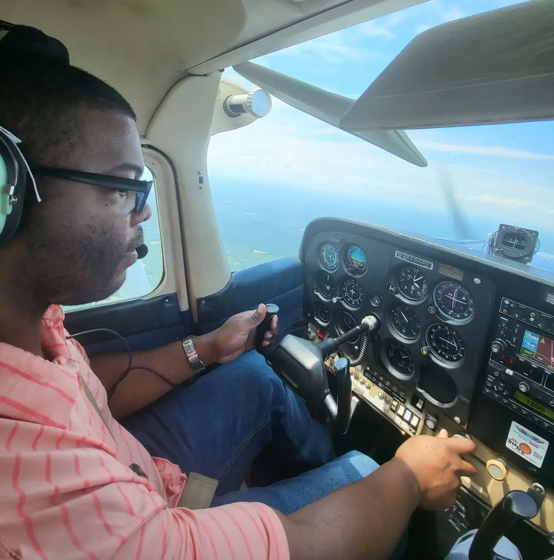 Student inside aircraft, ready for training