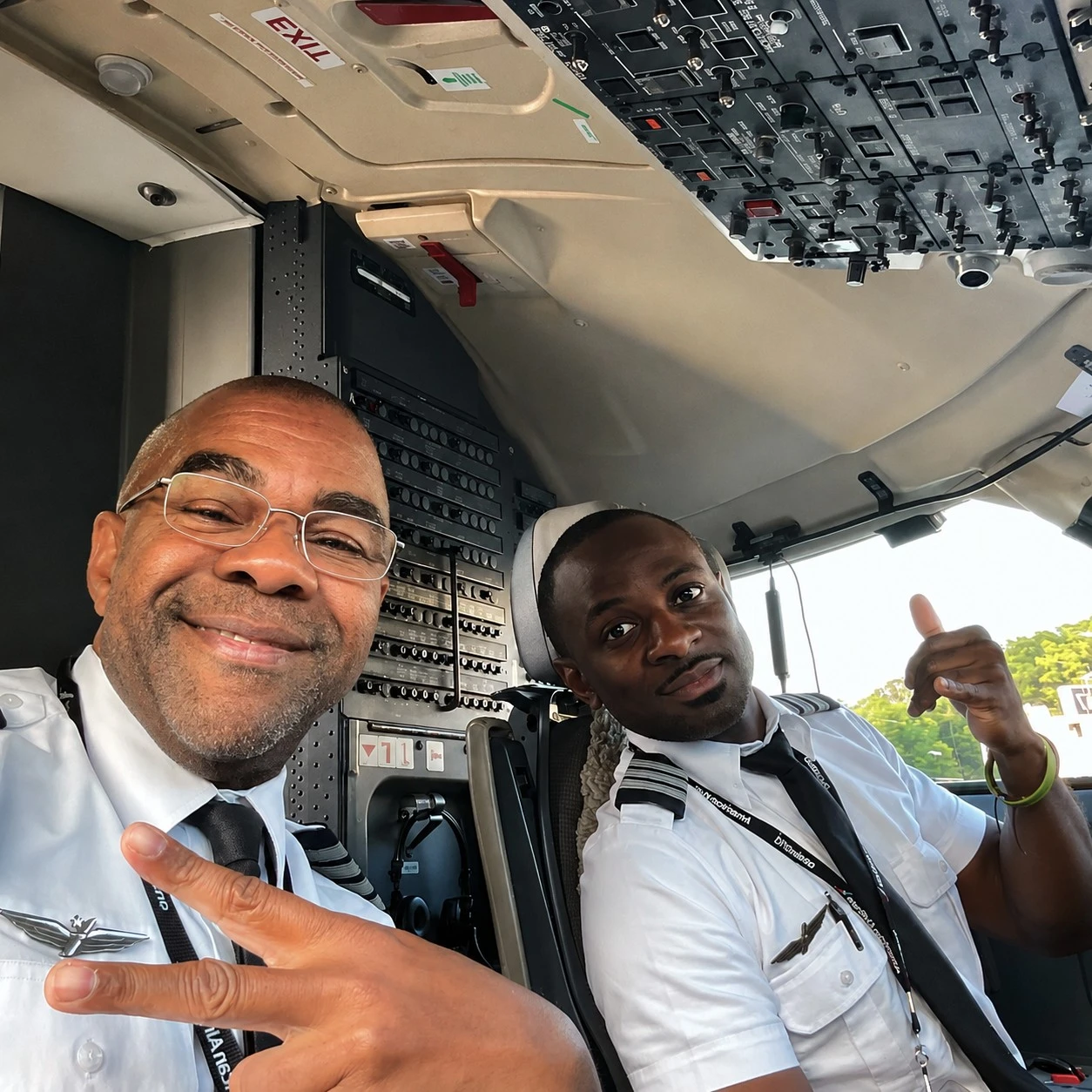 Student and flight instructor standing by an aircraft