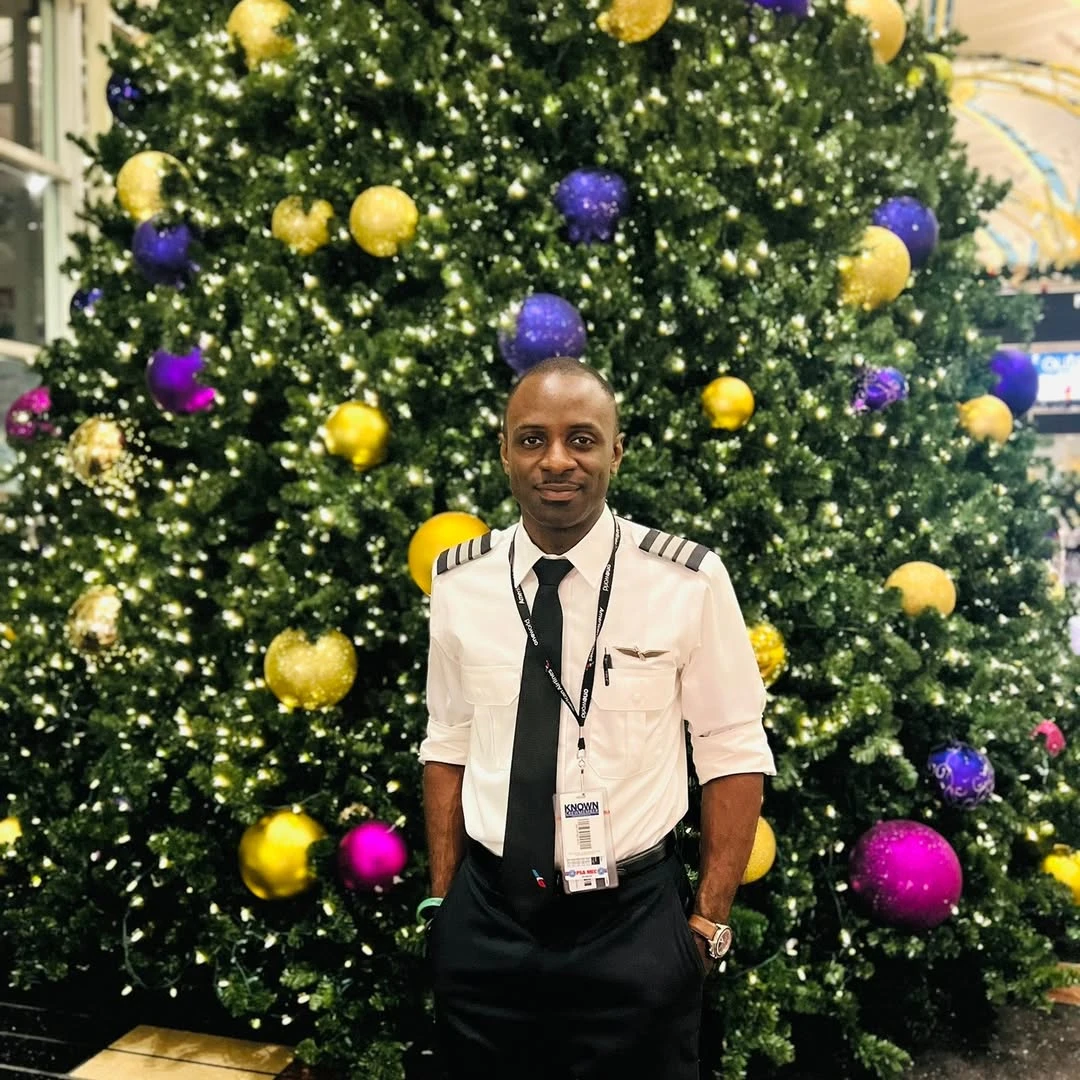 Yamarley posing in pilot uniform